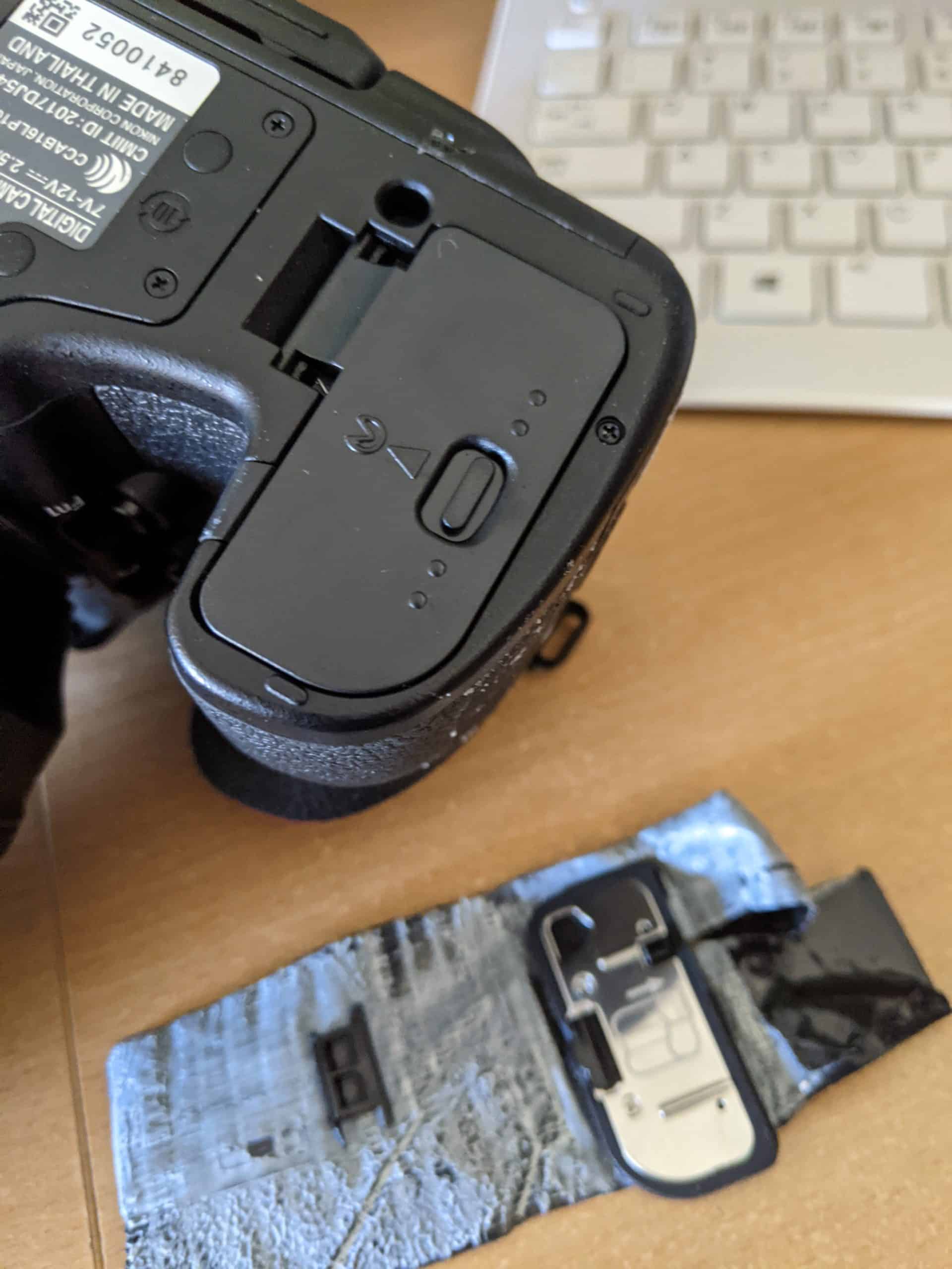 Replacing a Nikon D850 camera battery cover