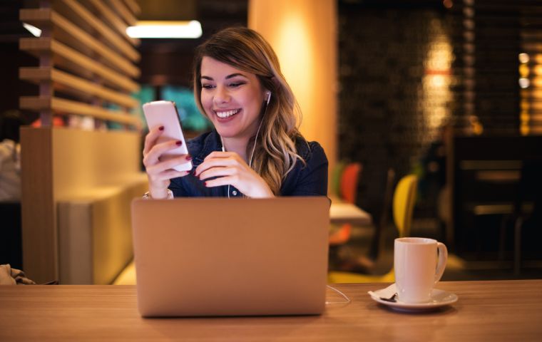 A photo of a lady smiling while she Promote your website.