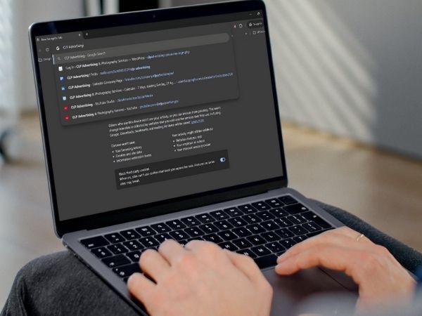 Person browsing search results for "CLP Advertising" on a laptop in incognito mode to perform a local SEO listing audit.