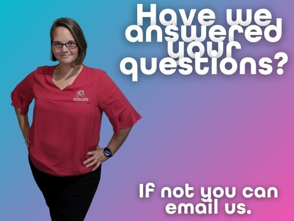 Ellie Clare, owner of CLP Advertising & Photography Services, stands in a red shirt against a gradient backdrop that invites readers to email any remaining questions.